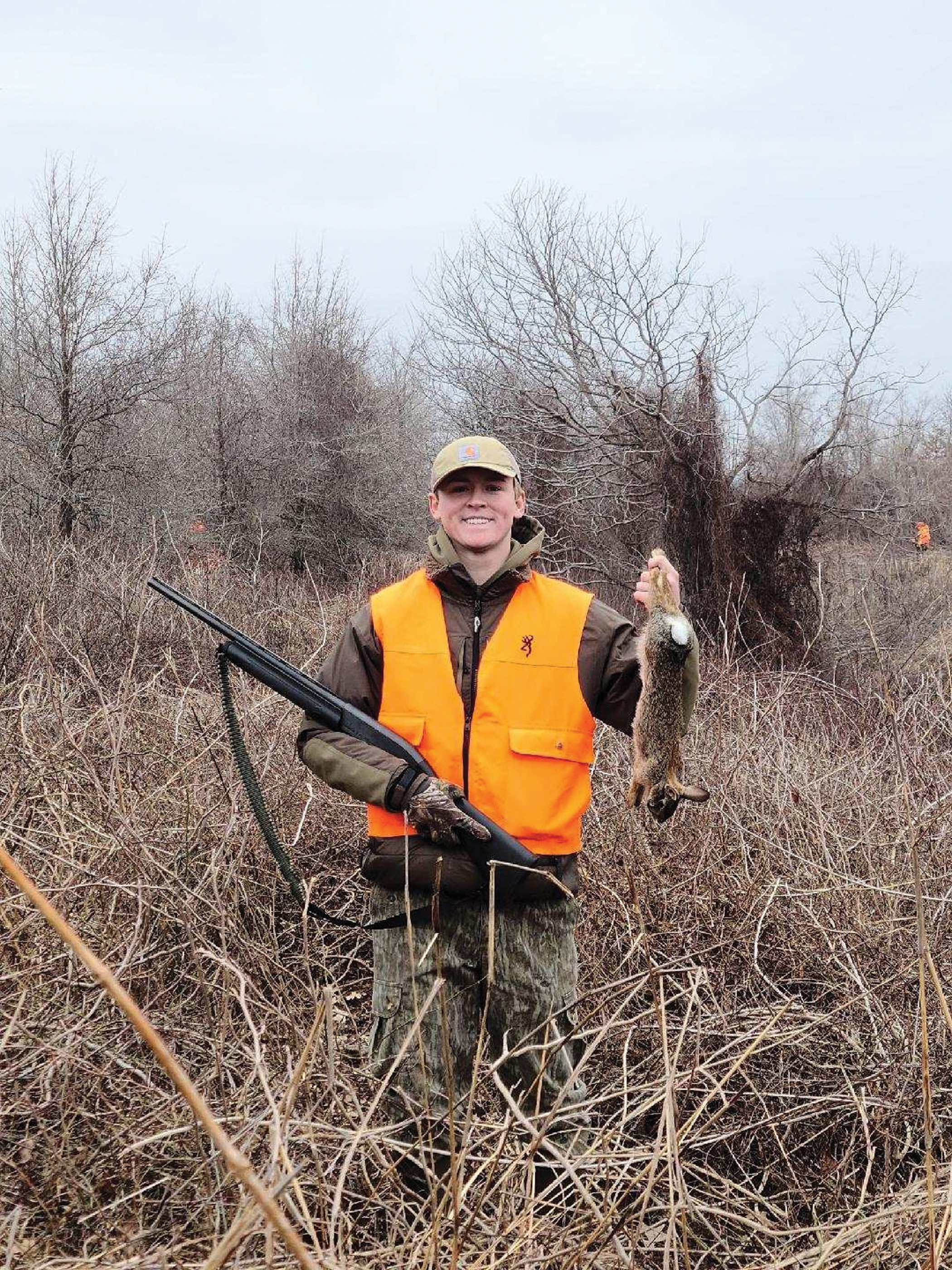 Andrew Coy of Jackson, Tenn. (grandson of Outdoors Editor Ernest Herndon), holds a rabbit killed on a hunt outside Clarksdale in the Mississippi Delta.
