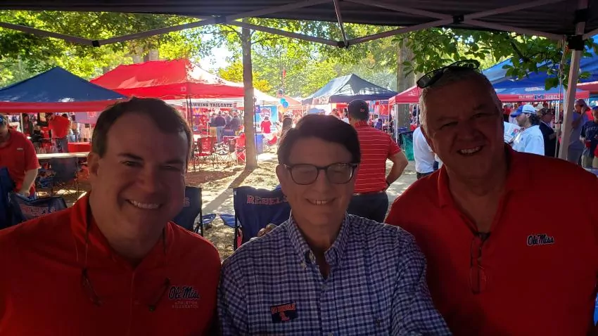 McCombs Clifton Van Cleave, Wyatt Emmerich and Clifton's friend from Australia who experienced his first football game.