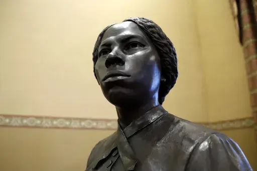 A bronze statue of abolitionist Harriet Tubman is seen at the Maryland State House, Feb. 10, 2020, in Annapolis, Md. (AP Photo/Julio Cortez, file)