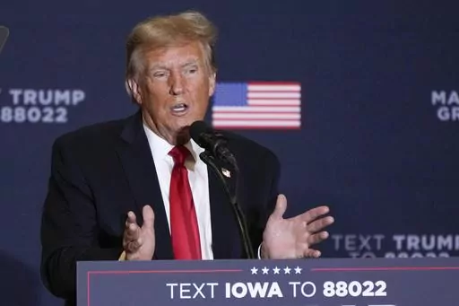 Former President Donald Trump speaks during a commit to caucus rally, Dec. 13, 2023, in Coralville, Iowa. Trump's lawyers are pressing to have special counsel Jack Smith's team held in contempt. The Republican former president's lawyers said Thursday, Jan. 4, 2024, prosecutors have taken steps to advance the 2020 election interference case against him in violation of a judge's order that put the case on hold. (AP Photo/Charlie Neibergall)