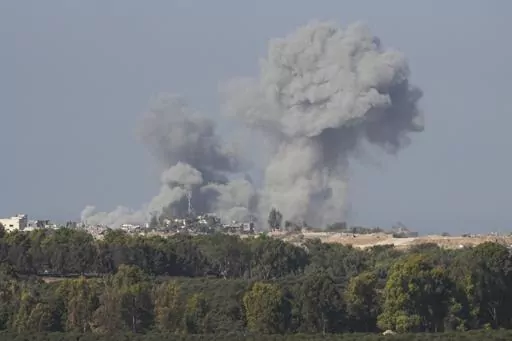 Smoke rises following an Israeli bombardment in the Gaza Strip, as seen from southern Israel on Monday, Dec. 4, 2023. (AP Photo/Ohad Zwigenberg)