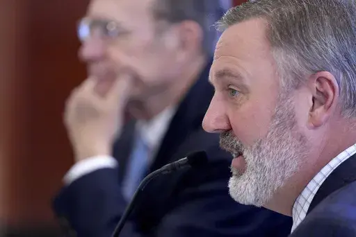 Republican Speaker of the House Jason White of West, right, speaks to members of the Mississippi Joint Legislative Budget Committee, while Republican Lt. Gov. Delbert Hosemann, left, listens, Wednesday, Dec. 11, 2024, in Jackson. (AP Photo/Rogelio V. Solis)
