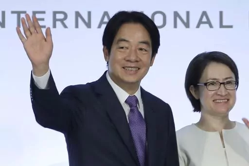 Taiwan Vice President and Democratic Progressive Party presidential candidate Lai Ching-te, who also goes by William, left, and his running mate Hsiao Bi-khim wave to the press during an international press conference in Taipei, Taiwan, on Jan. 9, 2024. Lai is currently Taiwan's vice president from the Democratic Progressive Party, which rejects China's sovereignty claims over the island. (AP Photo/Chiang Ying-ying, File)