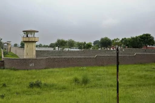 Police officers stand guard on the watch towers of district prison Attock, where Pakistan's former Prime Minister Imran Khan in-prison after his conviction, in Attock, Pakistan, Sunday, Aug. 6, 2023. Khan was arrested Saturday after a court handed him a three-year jail sentence for corruption, a development that could end his future in politics. (AP Photo/Anjum Naveed)