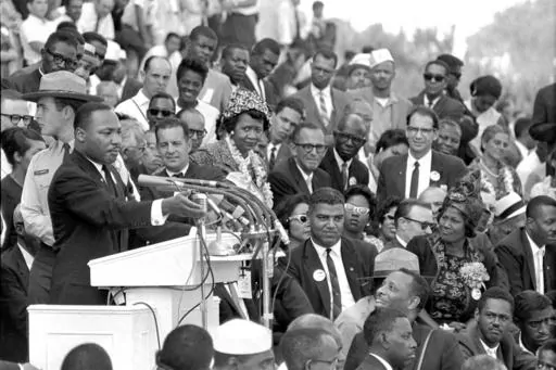 The Rev. Dr. Martin Luther King Jr., head of the Southern Christian Leadership Conference, speaks to thousands during his "I Have a Dream" speech in front of the Lincoln Memorial for the March on Washington for Jobs and Freedom in Washington on Aug. 28, 1963. Actor-singer Sammy Davis Jr. is at bottom right. (AP Photo/File)
