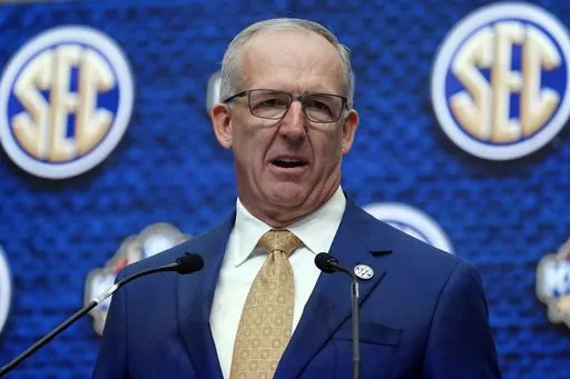 Southeastern Conference Commissioner Greg Sankey speaks during SEC Media Days, July 18, 2022, in Atlanta. The Southeastern Conference is sticking to an eight-game league schedule for at least two more seasons. The league announced on Wednesday, March 20, 2024 that teams will play eight SEC opponents in 2025 with one mandated game against a team from the ACC, Big Ten, Big 12, Pac-12 or a “major independent.” (AP Photo/John Bazemore, File)