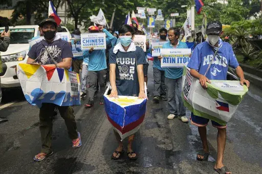 Filipino fishermen and activists wear boat costumes to protest against alleged Chinese aggression at the disputed South China Sea as they stage a rally in front of the Chinese consulate ahead of Independence Day in Makati, Philippines, on June 11, 2024. China has been at odds with many other countries in the Asia-Pacific for years over its sweeping maritime claims, including almost all of the South China Sea, a strategic and resource-rich waterway around which Beijing has drawn a 10-dash-line on