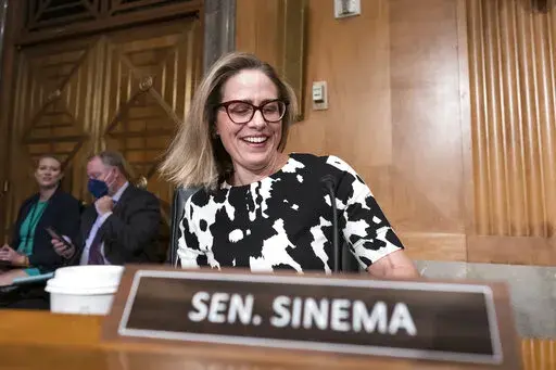Sen. Kyrsten Sinema, D-Ariz., arrives for a meeting of the Senate Homeland Security Committee at the Capitol in Washington, Aug. 3, 2022. The decision by Sinema to leave the Democratic Party raised the prospect of a tumultuous three-way race in one of the most politically competitive states in the U.S. It set off a scramble among potential Democratic and Republican candidates to assess whether they could win their party’s nomination. (AP Photo/J. Scott Applewhite, File)