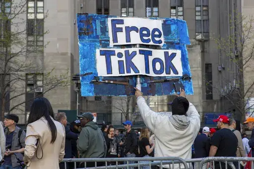 A man carries a Free TikTok sign in front of the courthouse where the hush-money trial of Donald Trump was underway on April 15, 2024, in New York. (AP Photo/Ted Shaffrey, File)