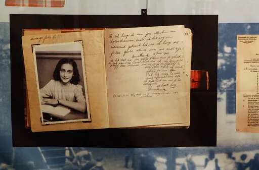A photo of Anne Frank is displayed at the opening of the exhibition: "Anne Frank, a History for Today", at the Westerbork Remembrance Centre in Hooghalen, northeast Netherlands, Firday, June 12, 2009. On Saturday, Oct. 15, 20222, Rebecka Fallenkvist, a Sweden Democrats official, was suspended by the far-right party for making degrading comments about Jewish teenage diarist Anne Frank. (AP Photo/Bas Czerwinski, File)