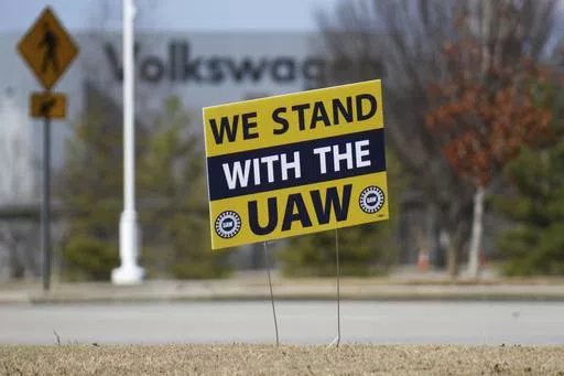 A "We stand with the UAW" sign appears outside of the Volkswagen plant in Chattanooga, Tenn., on Dec. 18, 2023. Workers at at the Tennessee factory are scheduled to finish voting Friday, April 19, 2024, on whether they want to be represented by the United Auto Workers union. (Olivia Ross/Chattanooga Times Free Press via AP, File)