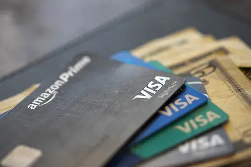 This Aug. 11, 2019 file photo shows credit cards in New Orleans. The possibility of a recession in the near future and the likely reduction in credit availability that is often associated with it may drive some small-business owners to explore financing options like a line of credit. (AP Photo/Jenny Kane, file)