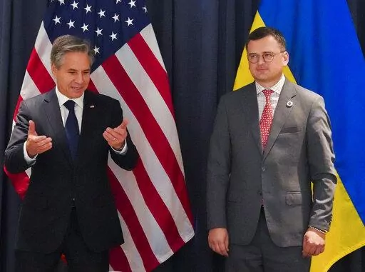 U.S. Secretary of State Antony Blinken, left, meets Ukraine's Foreign Minister Dmytro Kuleba on the sidelines of ASEAN summit held in Phnom Penh, Cambodia, Saturday, Nov. 12, 2022. (Cindy Liu/Pool Photo via AP)