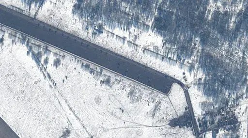 This Feb. 15, 2022 satellite image provided by Maxar Technologies shows attack helicopters deployed at Zyabrovka airfield in Belarus. (Satellite image ©2022 Maxar Technologies via AP)