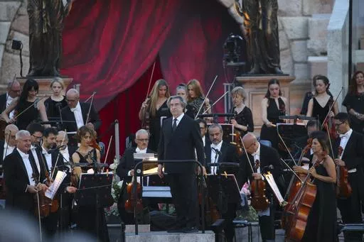 Italian Conductor Riccardo Muti acknowledges applause at a gala concert at the Verona Arena to celebrate the recognition by UNESCO of the Italian art of opera singing, in Verona, Italy, Friday, June 7, 2024. (Paola Garbuio/LaPresse via AP)