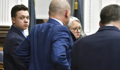 Kyle Rittenhouse looks back before going on a break during his trail at the Kenosha County Courthouse in Kenosha, Wis., on Monday, Nov. 15, 2021. (Sean Krajacic/The Kenosha News via AP, Pool)