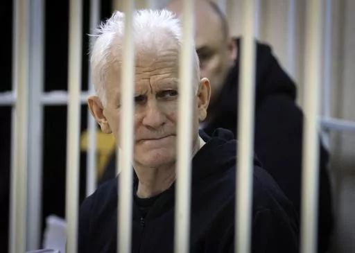 FILE Ales Bialiatski, the head of Belarusian Vyasna rights group, sits in a defendants' cage during a court session in Minsk, Belarus, on Thursday Jan. 5, 2023. For nearly three years, a harsh crackdown on dissent in Belarus by its authoritarian leader Alexander Lukashenko has filled the country’s penal colonies with thousands of political prisoners, with new arrests reported daily. At the same time, a government campaign has gotten rid of many independent lawyers, making it difficult for the 