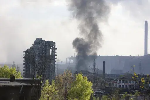 Smoke rises from the Azovstal steel mill in Mariupol, in territory under the government of the Donetsk People's Republic, eastern Ukraine, May 4, 2022. (AP Photo/Alexei Alexandrov, File)