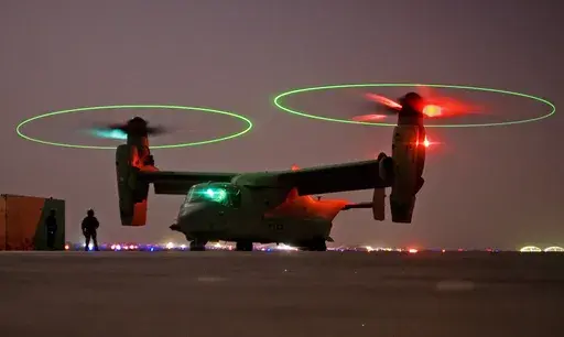 A V-22 Osprey tilt rotor aircraft taxi's during a mission in western Iraqi desert, Oct. 13, 2008. (AP Photo/Dusan Vranic, File)