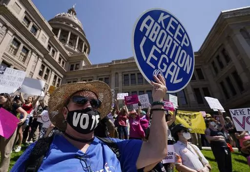 Abortion rights demonstrators attend a rally at the Texas state Capitol in Austin, Texas, May 14, 2022. A pregnant Texas woman whose fetus has a fatal diagnosis asked a court Tuesday, Dec. 5, 2023, to let her terminate the pregnancy, bringing what her attorneys say is the first lawsuit of its kind in the U.S. since Roe v. Wade was overturned last year.(AP Photo/Eric Gay, File)