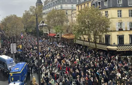 Thousands gather for a march against antisemitism in Paris, France, Sunday, Nov. 12, 2023. French authorities have registered more than 1,000 acts against Jews around the country in a month since the conflict in the Middle East began. (AP Photo/Sylvie Corbet)