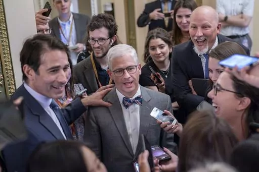 Top Republican debt crisis mediators Rep. Garret Graves, R-La., left, and Rep. Patrick McHenry, R-N.C., center, chairman of the House Financial Services Committee, with Rep. Chip Roy, R-Texas, upper right, have a laugh as they stop for questions by reporters on progress in the talks with the Biden administration, at the Capitol in Washington, Tuesday, May 23, 2023. Rep. Chip Roy, R-Texas, a member of the conservative House Freedom Caucus, has blasted the tentative debt ceiling deal struck by Spe