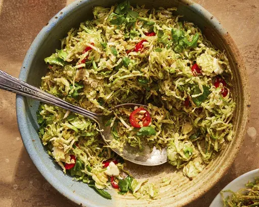 This image released by Milk Street shows a recipe for hot-oil Brussels sprouts with ginger and sesame. (Milk Street via AP)