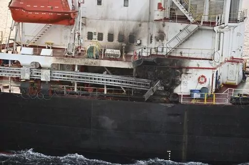 This photograph provided by the Indian Navy shows U.S.-owned ship Genco Picardy that came under attack Wednesday from a bomb-carrying drone launched by Yemen's Houthi rebels in the Gulf of Aden, Thursday, Jan.18, 2024. Attacks on ships in the Red Sea by Yemen's Houthi rebels have unraveled a key global trade route, forcing vessels into longer and more costly journeys around Africa. (Indian Navy via AP, File)