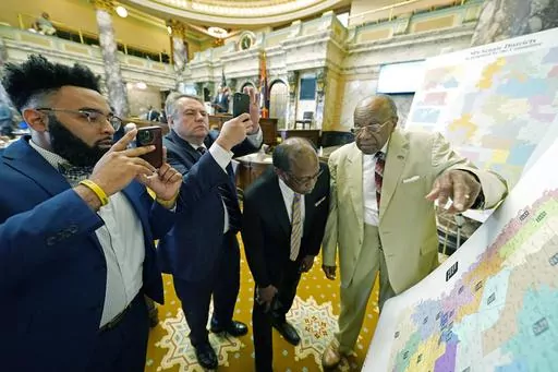 Mississippi state Sens. Rod Hickman, D-Macon, left; Michael McLendon, R-Hernando, second from left; Albert Butler, D-Port Gibson; and David Jordan, D-Greenwood, review an alternate Senate redistricting map during debate on the floor of the Senate at the state Capitol in Jackson, Miss., March 29, 2022. Three federal judges started hearing arguments on Monday, Feb. 26, 2024, in a lawsuit that challenges the racial composition of some Mississippi House and Senate districts. (AP Photo/Rogelio V. Sol