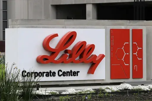 A sign for Eli Lilly & Co. stands outside their corporate headquarters in Indianapolis on April 26, 2017. (AP Photo/Darron Cummings, File)
