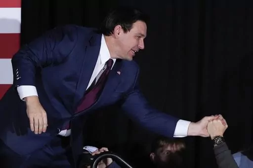 Republican presidential candidate Florida Gov. Ron DeSantis greets supporters during a caucus night party, Monday, Jan. 15, 2024, in West Des Moines, Iowa. (AP Photo/Charlie Neibergall)