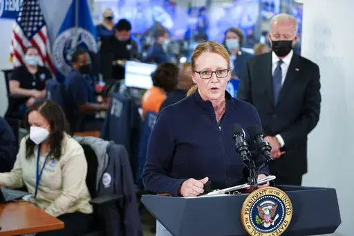 President Joe Biden listens as FEMA Administrator Deanne Criswell speaks at the National Response Coordination Center at FEMA headquarters, Sunday, Aug. 29, 2021, in Washington. (AP Photo/Manuel Balce Ceneta)