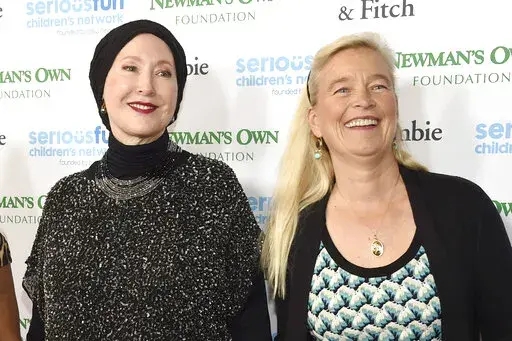 FILE — Susan Newman, left, and Nell Newman arrive at the SeriousFun Children's Network event at the Dolby Theatre, May 14, 2015, in Los Angeles. A new lawsuit filed Tuesday, Aug. 23, 2022, has exposed a deep rift between two of Paul Newman's daughters and the late actor's charitable foundation, over how it gives away some of the millions of dollars it makes off the Newman's Own line of food and drink products. (Photo by Chris Pizzello/Invision/AP, File)