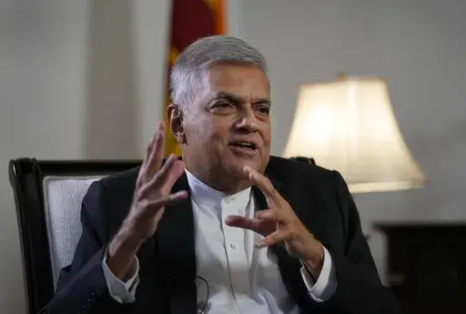 Sri Lanka's new prime minister Ranil Wickremesinghe gestures during an interview with The Associated Press in Colombo, Sri Lanka, Saturday, June 11, 2022. Sri Lanka may be compelled to buy more oil from Russia amid the island nation's unprecedented economic crisis, even as Western nations have largely boycotted Moscow as punishment for its invasion of Ukraine, the newly appointed prime minister said. (AP Photo/Eranga Jayawardena)