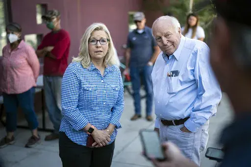 Rep. Liz Cheney, R-Wyo., arrives, with her father, former Vice President Dick Cheney, to vote at the Teton County Library during the Republican primary election Aug. 16, 2022, in Jackson Hole, Wyo. (Jabin Botsford/The Washington Post via AP, File)