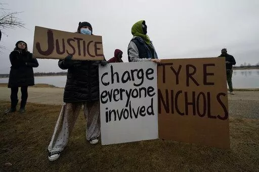 A group of demonstrators gather at dusk in Shelby Farms Park on Monday, Jan. 30, 2023, in Memphis, Tenn., in response to the death of Tyre Nichols, who died after being beaten by Memphis police officers. Nichols, who had a hobby in photography, frequented the park to photograph sunsets. (AP Photo/Gerald Herbert)