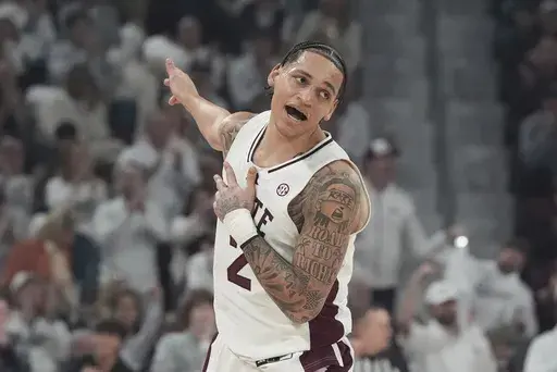 Mississippi State guard Riley Kugel (2) reacts as he scores a three-point shot during the first half of an NCAA college basketball game against Mississippi, Saturday, Jan. 18, 2025, in Starkville, Miss. (AP Photo/Rogelio V. Solis)