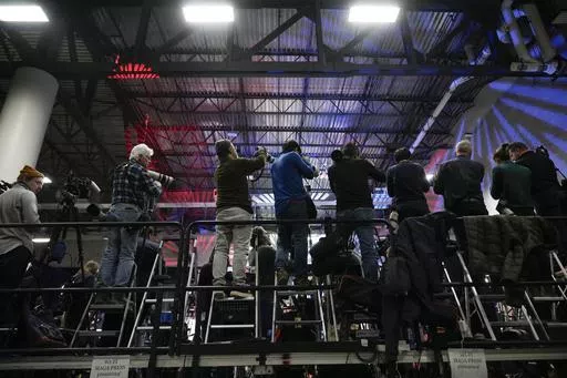 Journalists line the press stand before Republican presidential candidate former President Donald Trump speaks at a caucus night party in Des Moines, Iowa, Jan. 15, 2024. Attitudes toward the media and political news ahead of the election were explored in a poll from the American Press Institute and The Associated Press-NORC Center for Public Affairs Research. (AP Photo/Andrew Harnik, File)