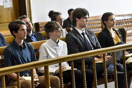 Plaintiffs Mica, 14; Badge 15, Lander 18, and Taleah, 19, listen to arguments during a status hearing on May 12, 2023, in Helena, Mont., for a case that they and other Montana youth filed against the state arguing Montana officials are not meeting their constitutional obligations to protect residents from climate change. The first-of-its-kind trial begins Monday, June 12, 2023, before District Court Judge Kathy Seeley in Helena. It is scheduled to last for two weeks. (Thom Bridge/Independent Rec