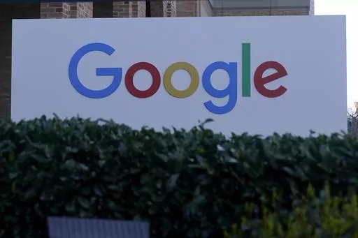 A Google sign is shown at the company's office in San Francisco, on April 12, 2023. European Union antitrust regulators on Wednesday, June 14, 2023, took aim at Google's lucrative digital advertising business, ordering the tech giant to sell off some of its ad services to address competition concerns. (AP Photo/Jeff Chiu)
