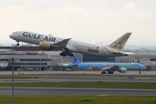 A plane takes off as Heathrow Airport slowly resumes flights after a fire cut power to Europe's busiest airport in London, Saturday, March 22, 2025.(AP Photo/Kirsty Wigglesworth)