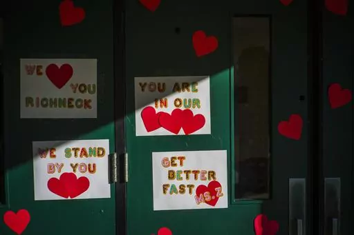 Messages of support for teacher Abby Zwerner, who was shot by a 6-year-old student, grace the front door of Richneck Elementary School Newport News, Va. on Jan. 9, 2023. Zwerner said Monday, March 20, that she has had four surgeries and has gone through a challenging recovery. (AP Photo/John C. Clark, File)