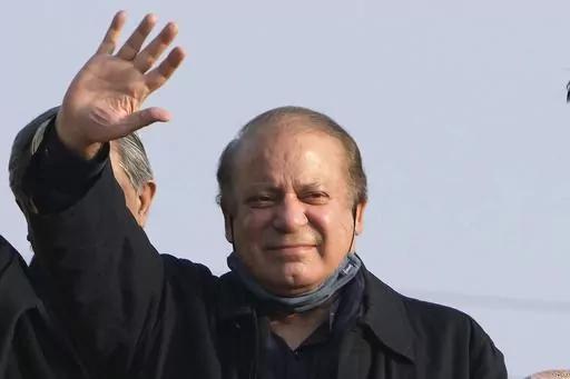 Pakistan's former Prime Minister Nawaz Sharif waves to his supporters as he arrives to address an election campaign rally in Hafizabad, Pakistan, Thursday, Jan. 18, 2024. Pakistan is holding elections for a new parliament on Thursday. No less than 44 political parties are vying for a share of the 266 seats that are up for grabs in the National Assembly, or the lower house of parliament, with an additional 70 seats reserved for women and minorities. (AP Photo/K.M. Chaudary, File)
