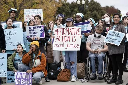 Activists demonstrate as the Supreme Court hears oral arguments on a pair of cases that could decide the future of affirmative action in college admissions, in Washington, Oct. 31, 2022. As the Supreme Court decides the fate of affirmative action, most Americans say the court should allow consideration of race as part of the admissions process, yet few believe students' race should play a significant role in decisions. (AP Photo/J. Scott Applewhite, File)