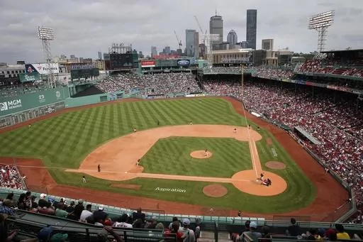 The Baltimore Orioles play against the Boston Red Sox during the eighth inning of the first baseball game of a doubleheader May 28, 2022, in Boston. Pickleball courts were being laid out in Fenway Park on Tuesday, July 11, 2023, in preparation for a weekend that will give fans of the sport a chance to watch the pros play or even give it a try themselves in the outfield of the Red Sox's historic home. (AP Photo/Michael Dwyer, File)