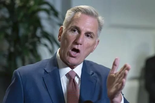 Speaker of the House Kevin McCarthy, R-Calif., talks to reporters about avoiding a government shutdown and launching an impeachment inquiry into President Joe Biden, following a closed-door meeting with fellow Republicans at the Capitol in Washington, Sept. 14, 2023. (AP Photo/J. Scott Applewhite, File)