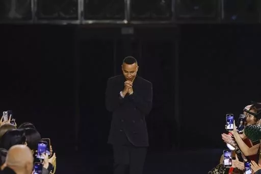 Designer Olivier Rousteing accepts applause after the conclusion of the Balmain Fall/Winter 2023-2024 ready-to-wear collection presented Wednesday, March 1, 2023 in Paris. Balmain artistic director Olivier Rousteing says robbers have made off with more than 50 pieces of the new collection that his Paris house intends to show at Fashion Week later this month. (Vianney Le Caer/Invision/AP, file)