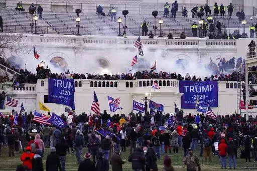 Violent rioters, loyal to President Donald Trump, storm the Capitol in Washington, Jan. 6, 2021. Opening statements are expected to begin Monday, Dec. 12, 2022, in the second seditious conspiracy trial against members of the far-right Oath Keepers extremist group charged in the Jan. 6, Capitol attack. The defendants facing jurors in the latest trial are Joseph Hackett, Roberto Minuta, David Moerschel, and Edward Vallejo. (AP Photo/John Minchillo, File)