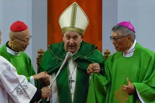 Pope Francis is joined by Cardinal John Tong Hon, left, and Cardinal-elect Stephen Chow, both from Hong Kong, after presiding over a mass at the Steppe Arena in the Mongolian capital Ulaanbaatar, Sunday, Sept. 3, 2023. Francis is in Mongolia to minister to one of the world's smallest and newest Catholic communities. Neighboring China's crackdown on religious minorities has been a constant backdrop to the trip, even as the Vatican hopes to focus attention instead on Mongolia and its 1,450 Catholi