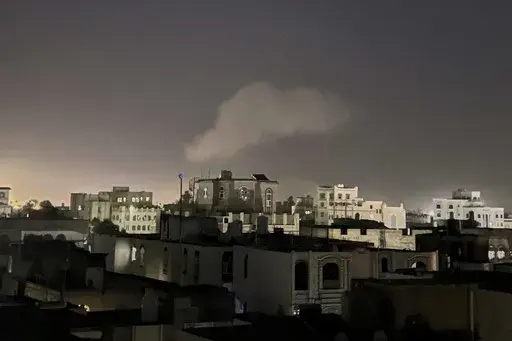 Smoke rises from a location reportedly struck by U.S. airstrikes in Sanaa, Yemen, Sunday, March 30, 2025. (AP Photo)
